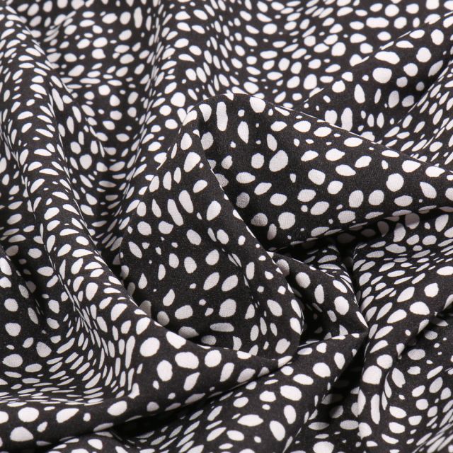 Tissu Polyester Stretch Mini dalma blanc sur fond Noir