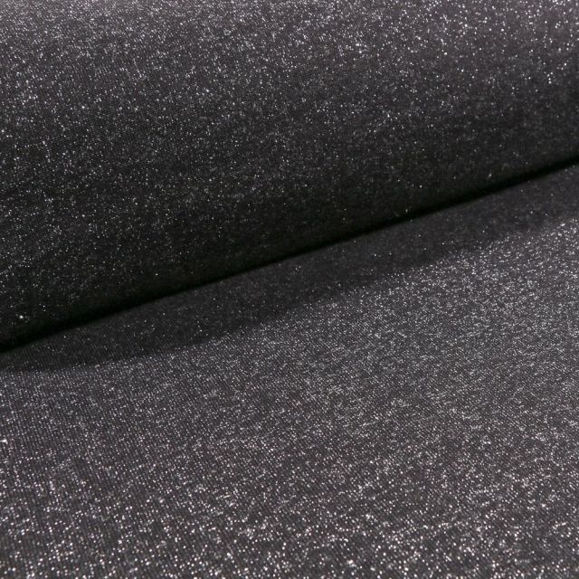 Tissu Sweat Paillettes argentées sur fond Noir - Par 10 cm