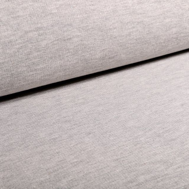 Tissu Sweat Paillettes argentées sur fond Gris clair chiné - Par 10 cm