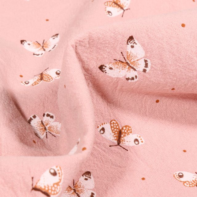 Tissu Coton lavé Papillons colorés sur fond Rose poudré