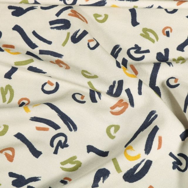Tissu Jersey Modal Traits de feutre verts et oranges sur fond Blanc cassé - Par 10 cm