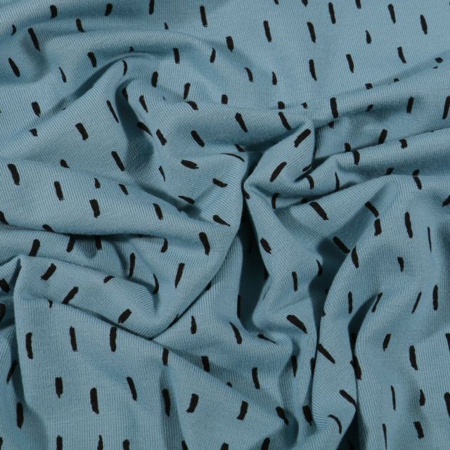Tissu Jersey Coton Bio Pointillés noirs sur fond Bleu ciel - Par 10 cm