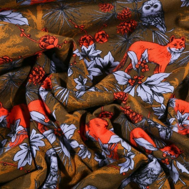 Tissu Jersey Coton Renards orange fluo en forêt sur fond Vert kaki - Par 10 cm