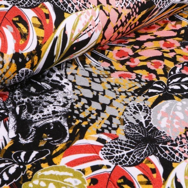Tissu Jersey Viscose Fleurs et léopards colorés sur fond Noir - Par 10 cm