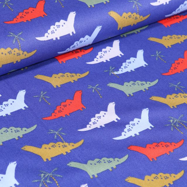 Tissu Coton imprimé LittleBird Dinosaures colorés sur fond Bleu roi