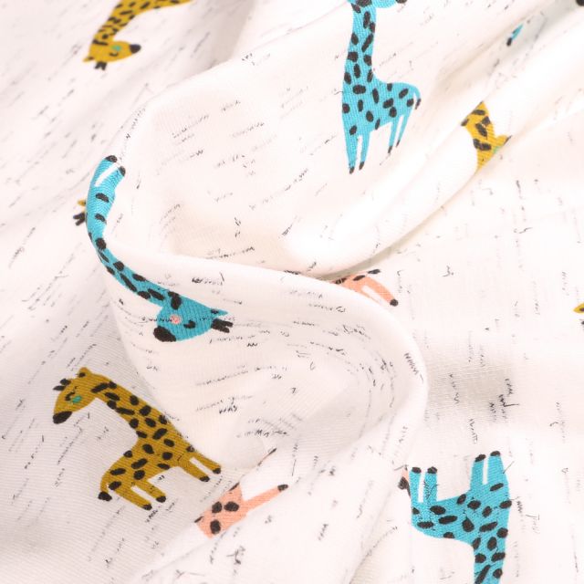 Tissu Jersey Coton Girafe multicolores sur fond Blanc chiné