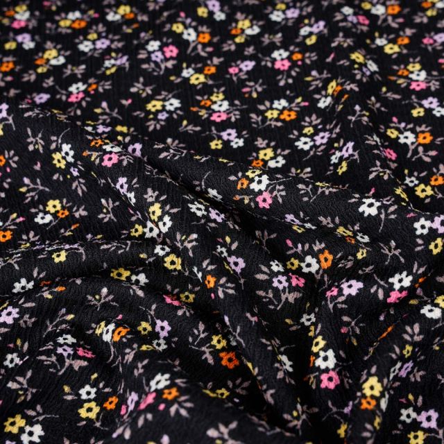 Tissu Crépon imprimé fleuris fuchsia sur fond Noir