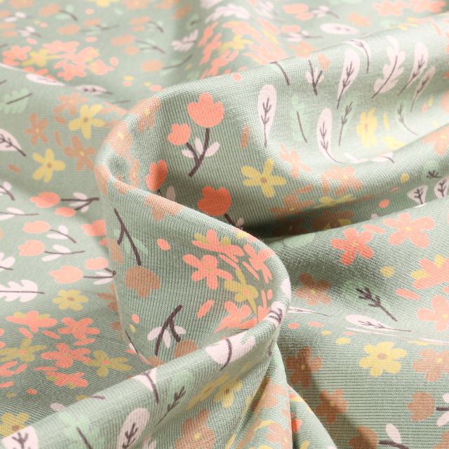 Tissu Jersey Coton Petites feuilles et fleurs colorés sur fond Vert pâle