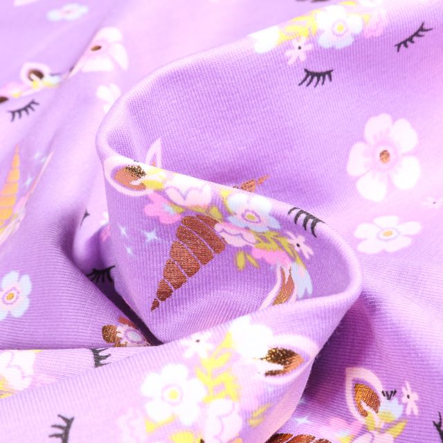 Tissu Jersey Coton Tête de licorne fleuris doré sur fond Violet