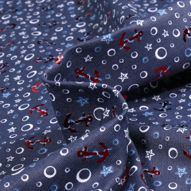 Tissu Jersey Coton Etoiles et ancres marine métalisées sur fond Bleu marine