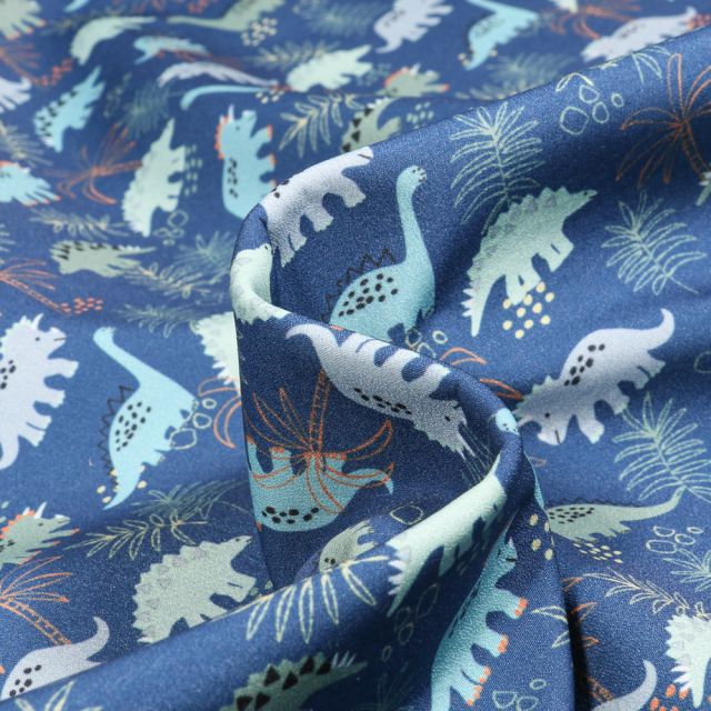 Tissu Softshell Dino jungle sur fond Bleu