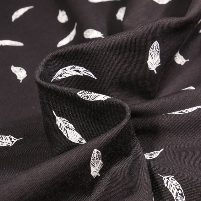 Tissu Jersey Coton Camille Plumes blanches sur fond Noir