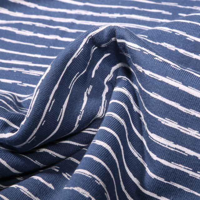 Tissu Jersey Coton Rayures destructurées sur fond Bleu denim