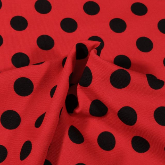 Tissu Jersey Coton Pois noirs 1.5 cm sur fond Rouge - Par 10 cm