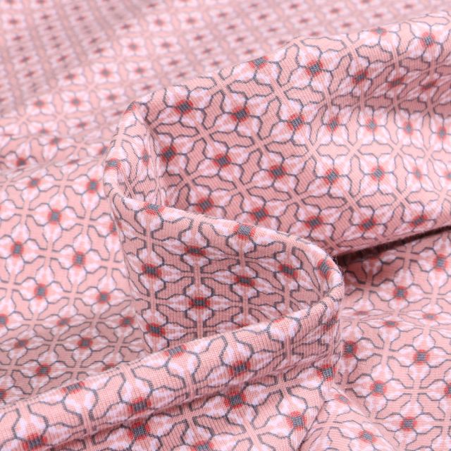 Tissu Jersey Coton Bio Fleurs liées sur fond Rose pâle