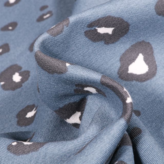 Tissu Jersey Coton Bio Tâche léopard sur fond Bleu denim