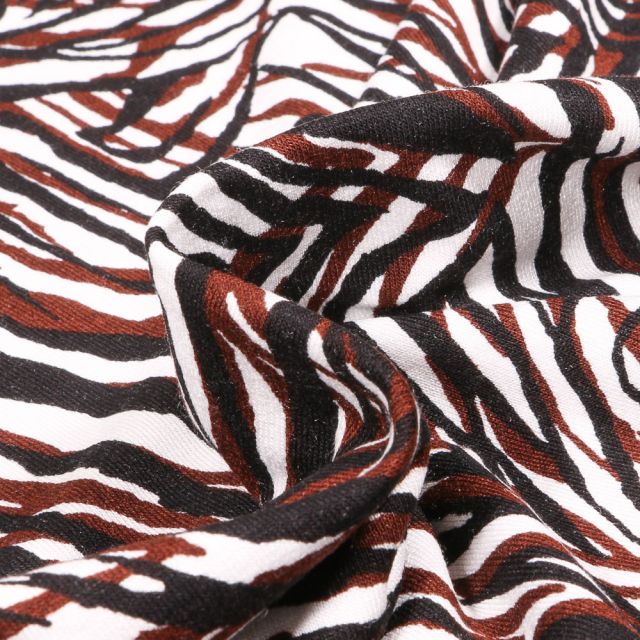 Tissu Jersey Viscose  Motifs abstraits marron et noirs sur fond Blanc