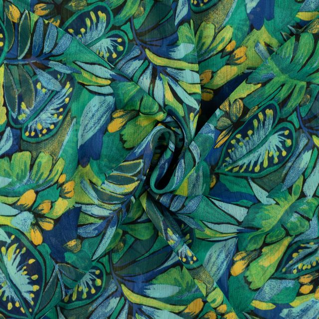 Tissu Mousseline Crépon Fleurs vertes sur fond Bleu