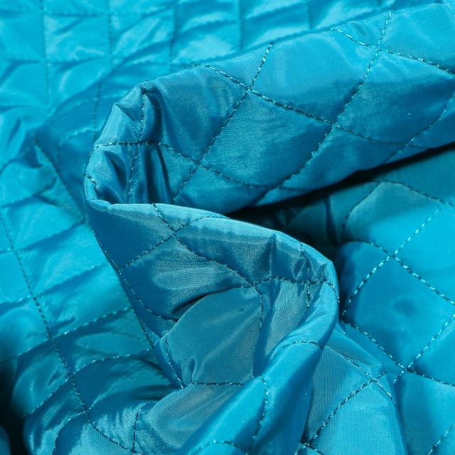 Tissu Doudoune matelassé Dahli sur fond Bleu turquoise