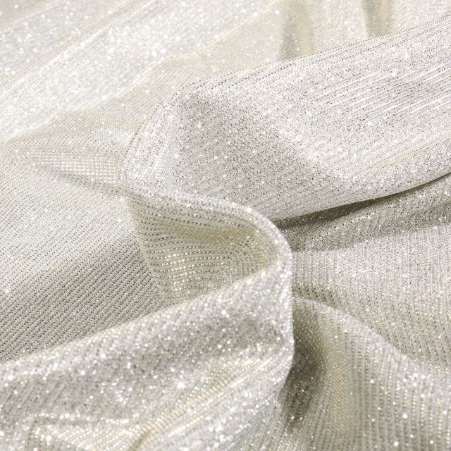 Tissu Jersey Lurex Pailleté Argent sur fond Cristal - Par 10 cm