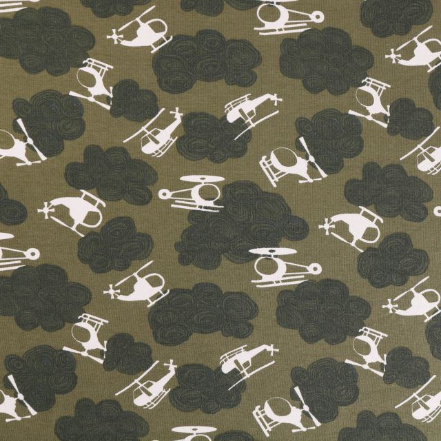 Tissu Sweat léger envers gratté Hélicoptères et nuages Blancs et gris bleuté sur fond Kaki - Par 10 cm