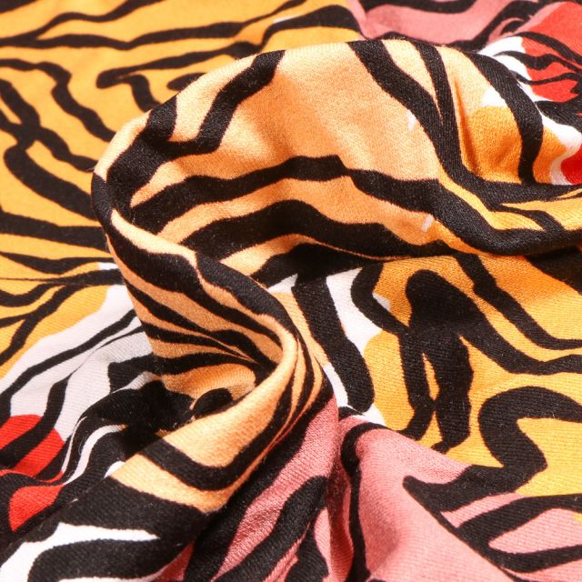 Tissu Jersey Viscose avec aspect crêpe Abstraits sur fond Orange