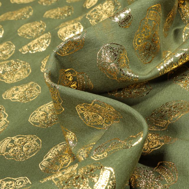 Tissu Jersey Coton Têtes de morts métallisées sur fond Vert kaki
