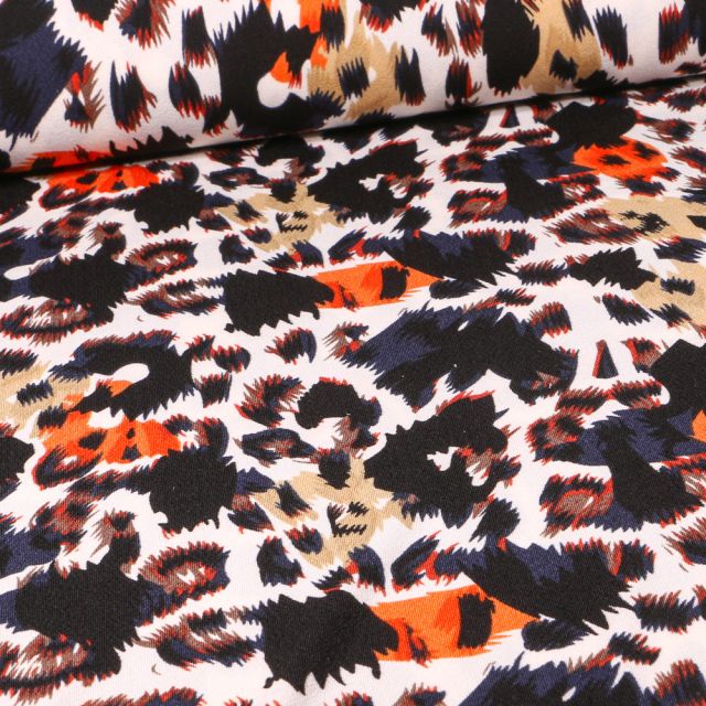 Tissu Jersey crêpe Taches léopard  colorés orange sur fond Blanc cassé
