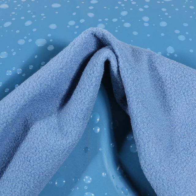Tissu Softshell Perles d'eau sur fond Bleu