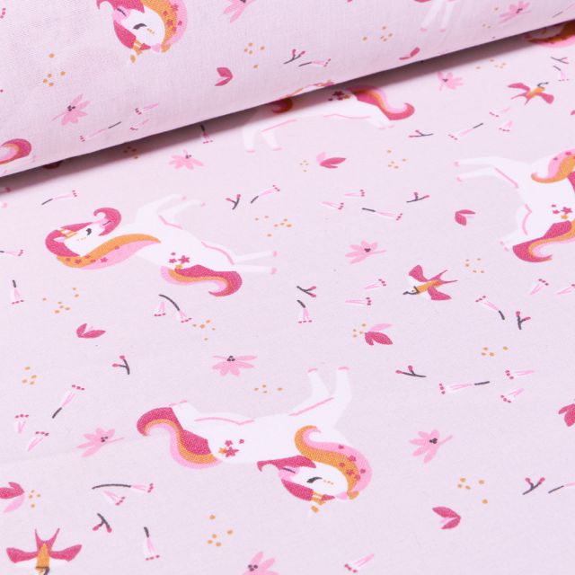 Tissu Coton imprimé Arty Licornes et petites fleurs sur fond Rose