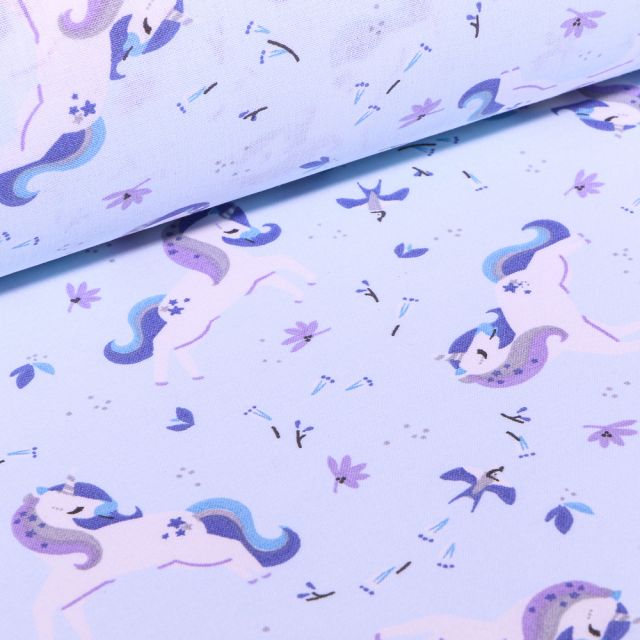 Tissu Coton imprimé Arty Licornes et petites fleurs sur fond Bleu ciel