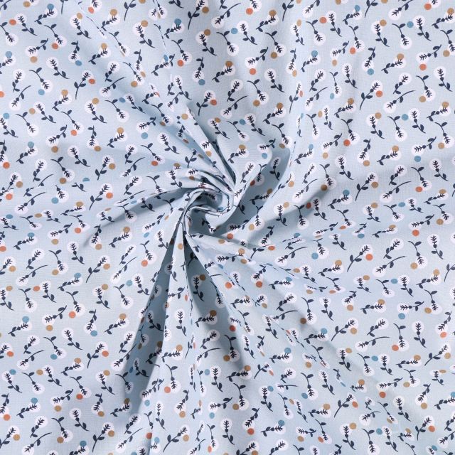 Tissu Coton imprimé  Arty Feuillages blancs marrons et bleus sur fond Bleu ciel - Par 10 cm