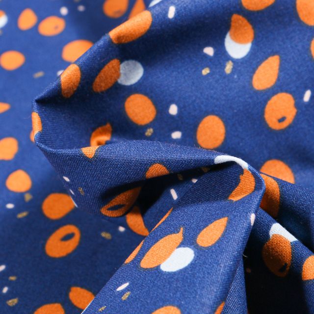 Tissu Coton imprimé Craftine  Pois destructurés orange et blanc sur fond Bleu roi