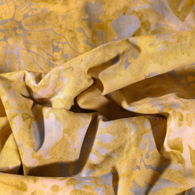 Tissu Batik Chardon sur fond Ocre - Par 10 cm