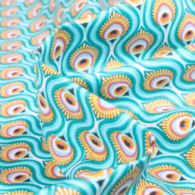 Tissu Coton enduit Feuilles de Paon sur fond Bleu lagon