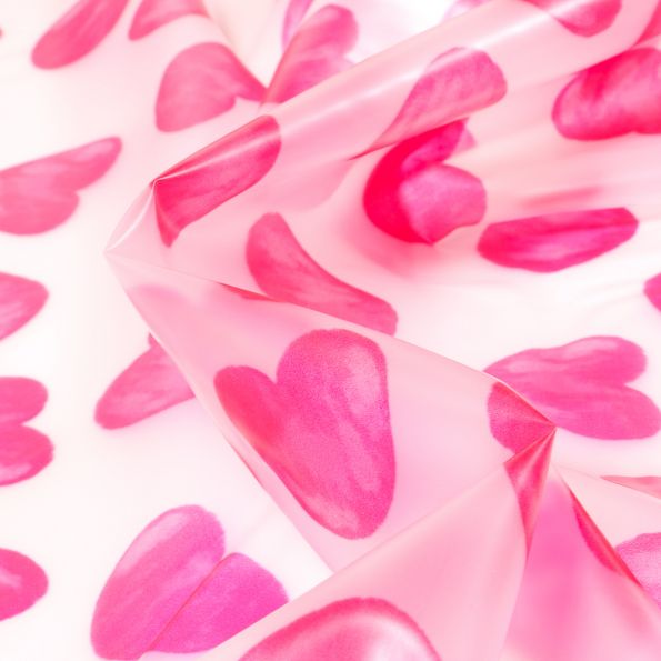 Tissu imperméable Coeurs rose sur fond Transparent - Par 10 cm