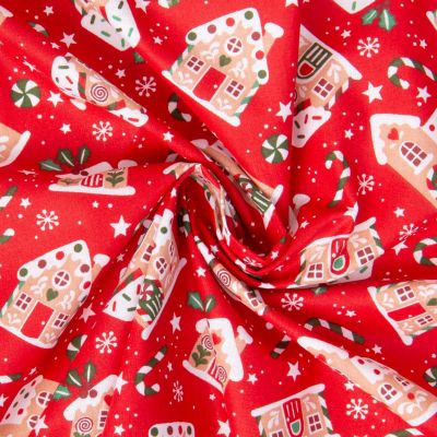 Tissu Coton imprimé Arty Santa maisons en pain d&#039;épice sur fond Rouge - Par 10 cm