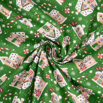 Tissu Coton imprimé Arty Santa maisons en pain d&#039;épice sur fond Vert - Par 10 cm