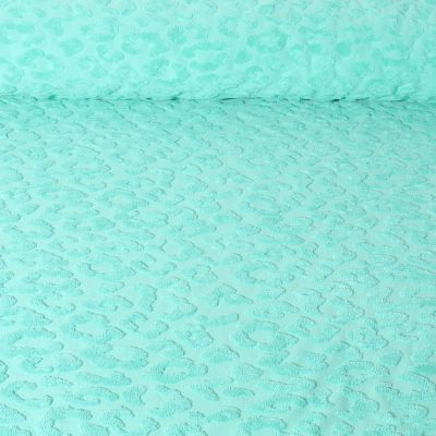 Tissu Maille motif léopard éponge sur fond Vert menthe - Par 10 cm