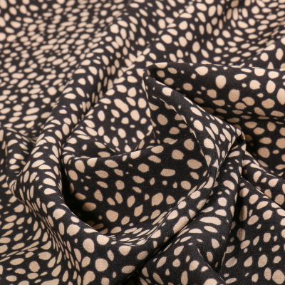 Tissu Polyester Stretch Mini Dalma beige sur fond Noir - Par 10 cm