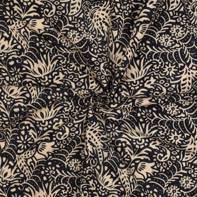 Tissu Batik de Coton fines arabesques écru sur fond Noir profond - Par 10 cm