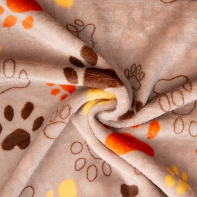 Tissu Doudou imprimé empreintes sauvage sur fond Beige sable - Par 10 cm