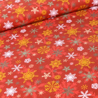 Tissu Coton imprimé Bio Flocons colorés sur fond Rouge - Par 10 cm