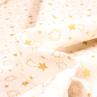 Tissu Coton imprimé Bio Etoiles filantes dorées sur fond Blanc cassé - Par 10 cm