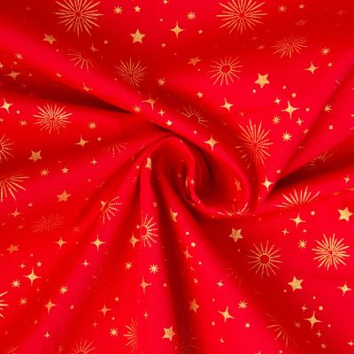Tissu Coton imprimé étoiles dorés de noël sur fond Rouge - Par 10 cm