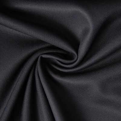 Tissu Sergé Polyviscose  Hispania sur fond Noir - Par 10 cm