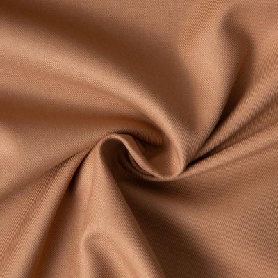 Tissu Sergé Polyviscose  Hispania sur fond Camel - Par 10 cm
