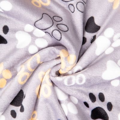 Tissu Doudou imprimé empreintes pattes sur fond Gris - Par 10 cm
