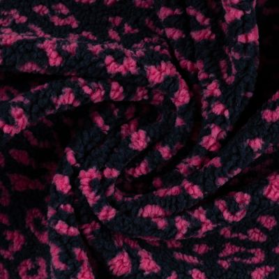 Tissu Teddy Bouclettes motif léopard Fuschia sur fond Bleu marine - Par 10 cm