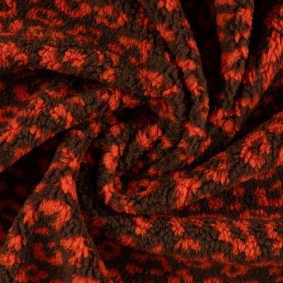 Tissu Teddy Bouclettes motif léopard Orange sur fond Marron - Par 10 cm